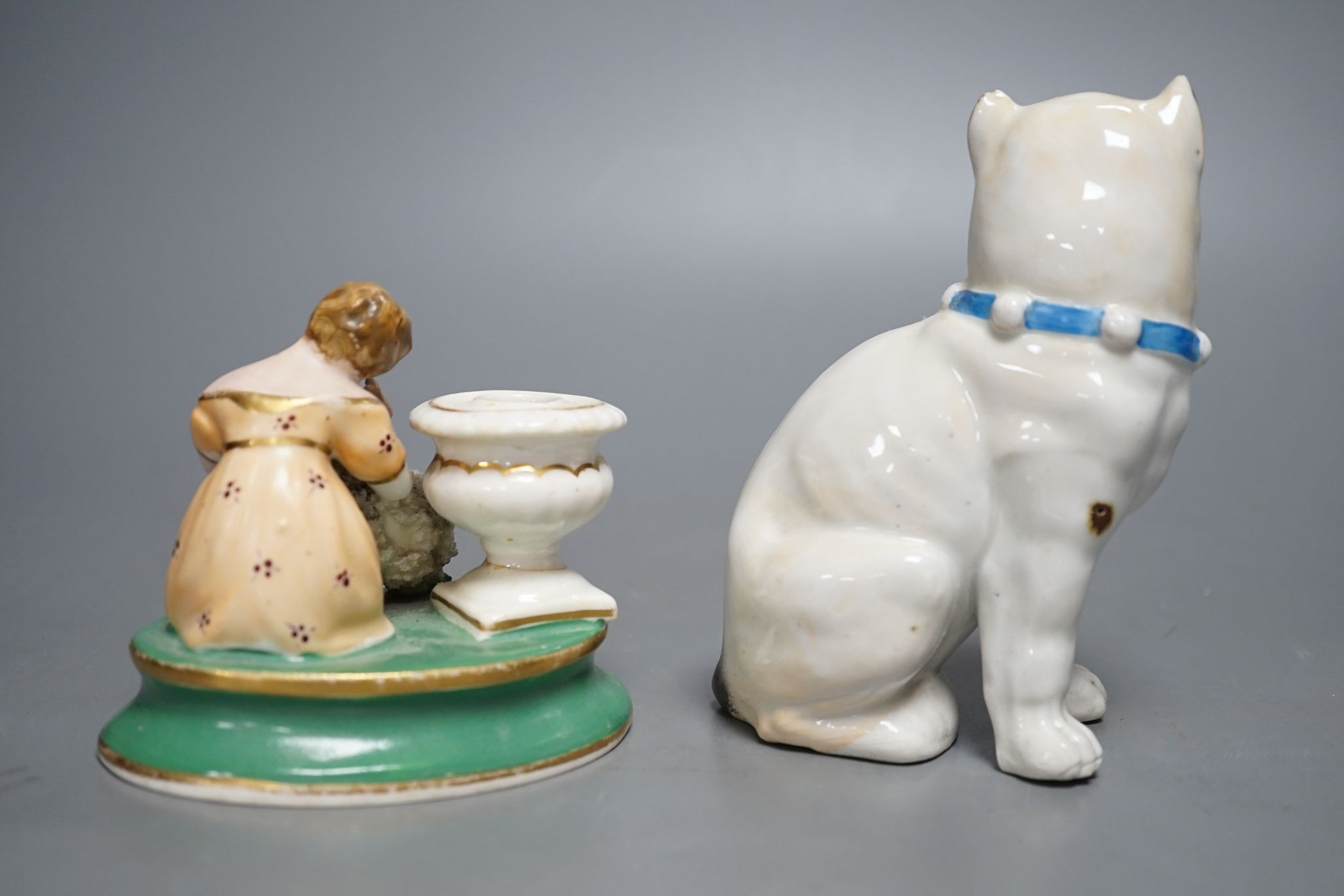 An English porcelain girl with sheep inkwell, c.1835 and a Continental porcelain pug dog, 14cm